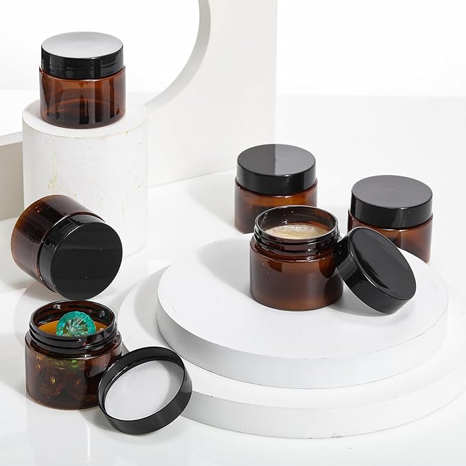 SATINIOR 24 Pieces Empty Clear Plastic Jars with Lids Round Storage Containers Wide Mouth for Beauty Product Cosmetic Cream Lotion Liquid Butter Craft and Food(Amber Lid,2 oz)