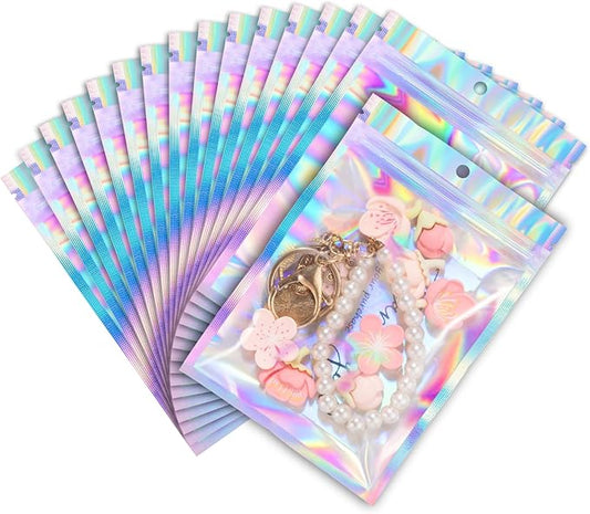 ANZNKU 100 Pack Mylar Bags Reasealable Holographic Bags, Smell Proof Bag Zipper Pouches with Clear Window, Jewelry Candy Sealable Bag for Packaging Sample Party Favor (5.1 x 8.3 Inch)